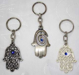 These amulet pendants are in the shape of a Hamsa, an ancient symbol 