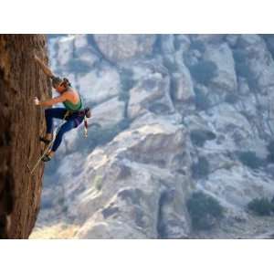  A Man Climbing a Rock Face at Hueco Tanks National 