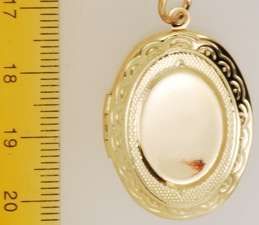 YBM oval engraved locket, slate cameo, bouquet  