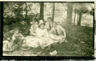 edwardian women & kids having picnic in the woods  