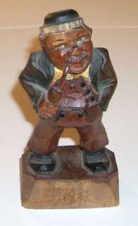 This a Vintage ANRI Carved Wooden Figure of a Man with a Pipe.