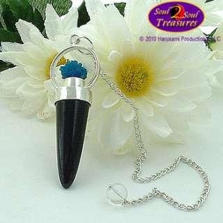 gleaming black polished point of Black Tourmaline encased in non 
