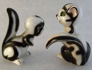stylized cartoon character type squirrels they have big green eyes and 