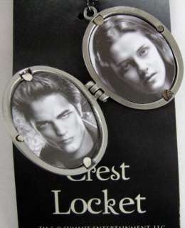   locket with the cullen family crest inside includes pictures of bella