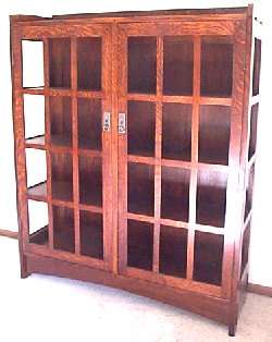 Mission style hammered copper pulls with locking doors This cabinet 