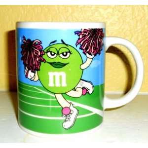  Green M&M Girl Cheerleader Mug Purple Pom Poms Blue Peanut 